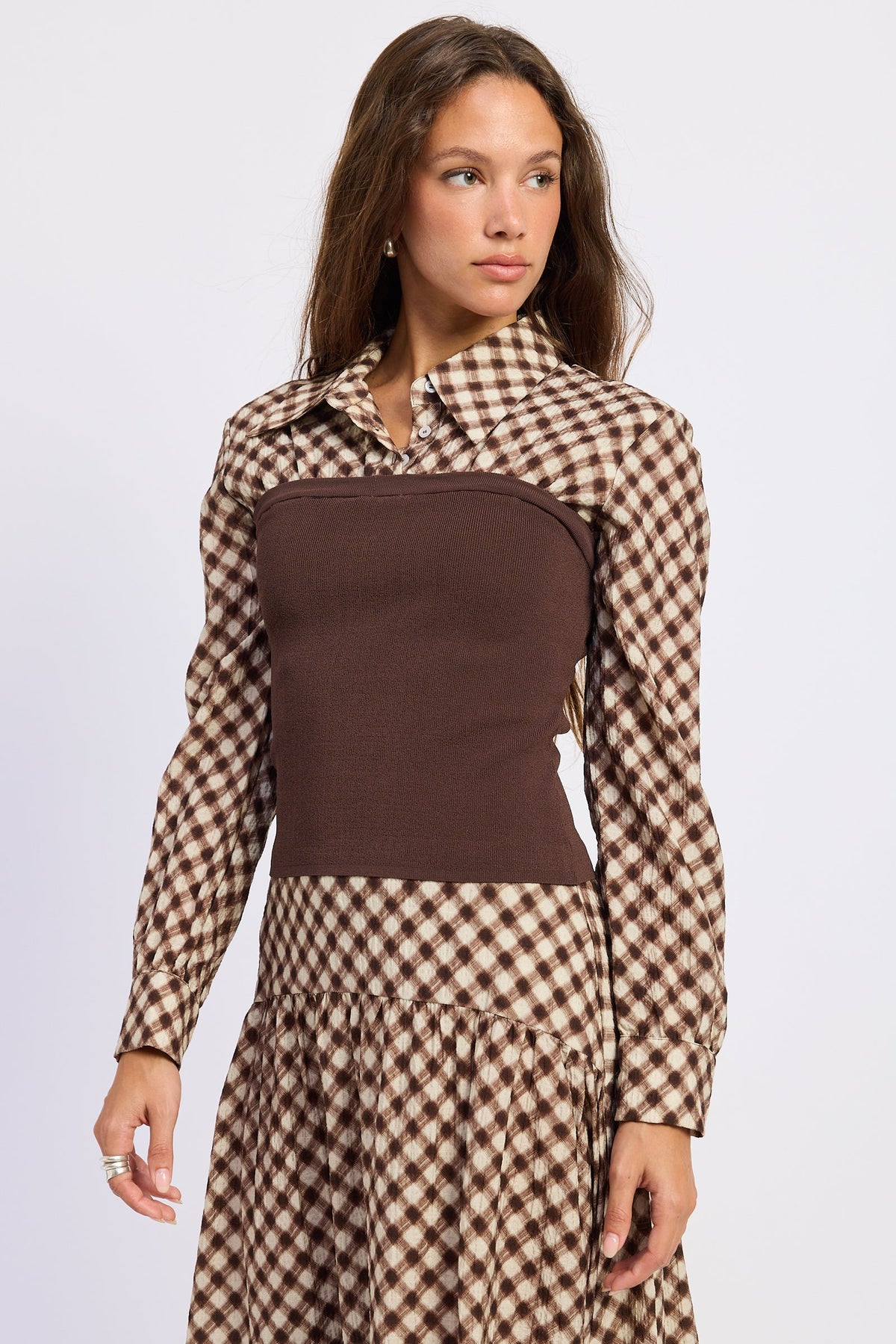 Angled front view of Thea espresso plaid collared top showing contrast knit body and long sleeves.