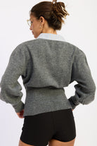 Back view of charcoal gray Cambridge Contrast Collar Sweater showing fitted waist panel and striped cotton collar.