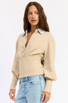 Close front view of oatmeal Cambridge sweater showing button neckline, gathered bust and wide fitted waist panel.
