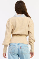 Back view of oatmeal Cambridge Contrast Collar Sweater showing striped cotton collar, shaped waist and balloon sleeves.