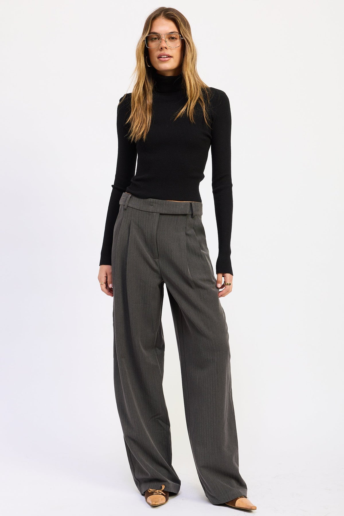 Madison Wide Leg Trousers in charcoal gray featuring front pleats, tailored waistband and full length wide leg silhouette.