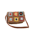 Model wearing straw khaki version of the bag with multicolor crochet squares-AVAH