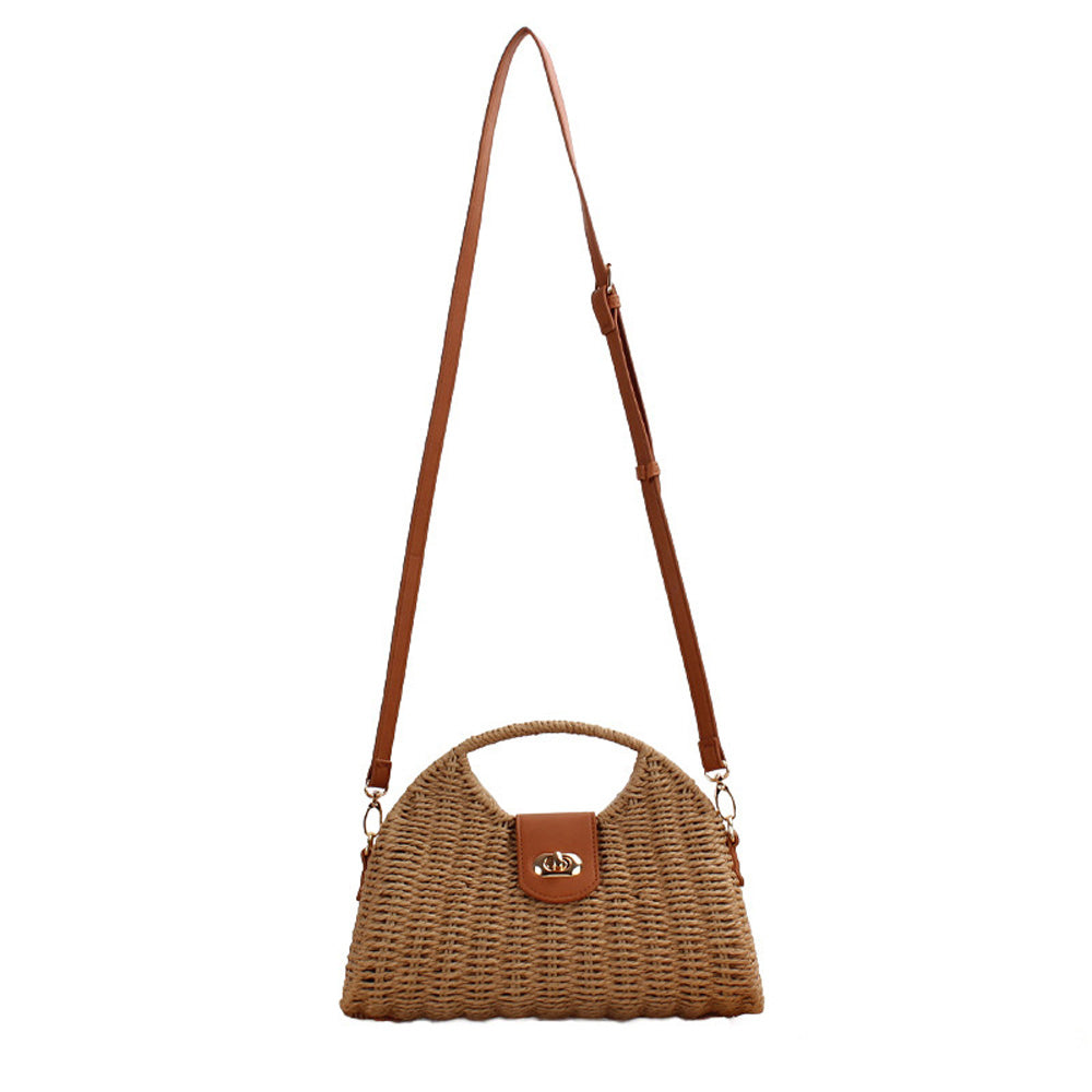 Straw crossbody bag with vegan leather and fixed top handle and removable crossbody strap complete with a fold over clasp and gold hardware, in khaki front view