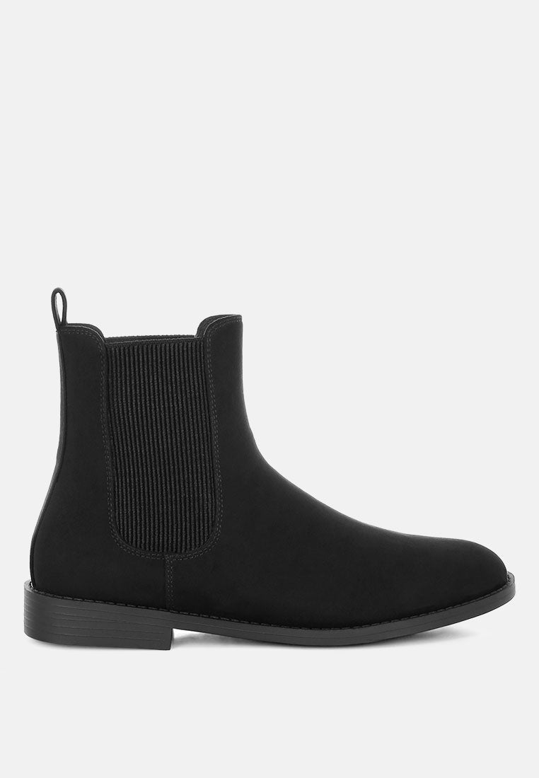 Black Chelsea boot on a white background