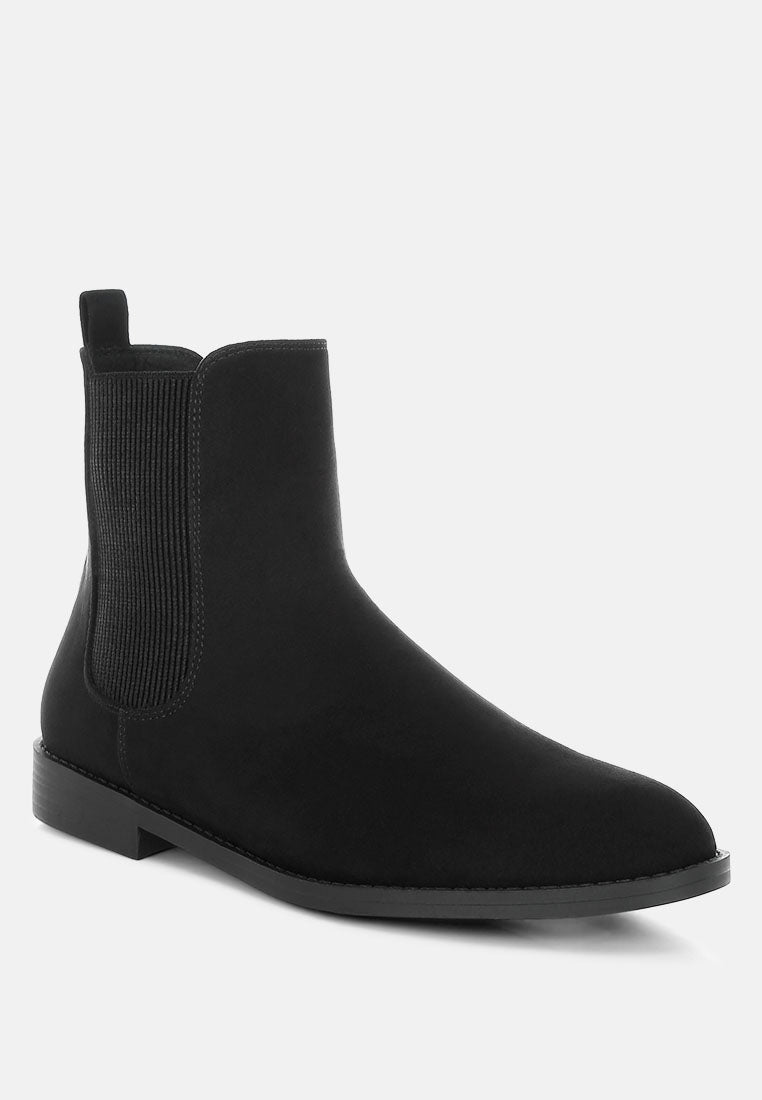 Black Chelsea boot on a white background
