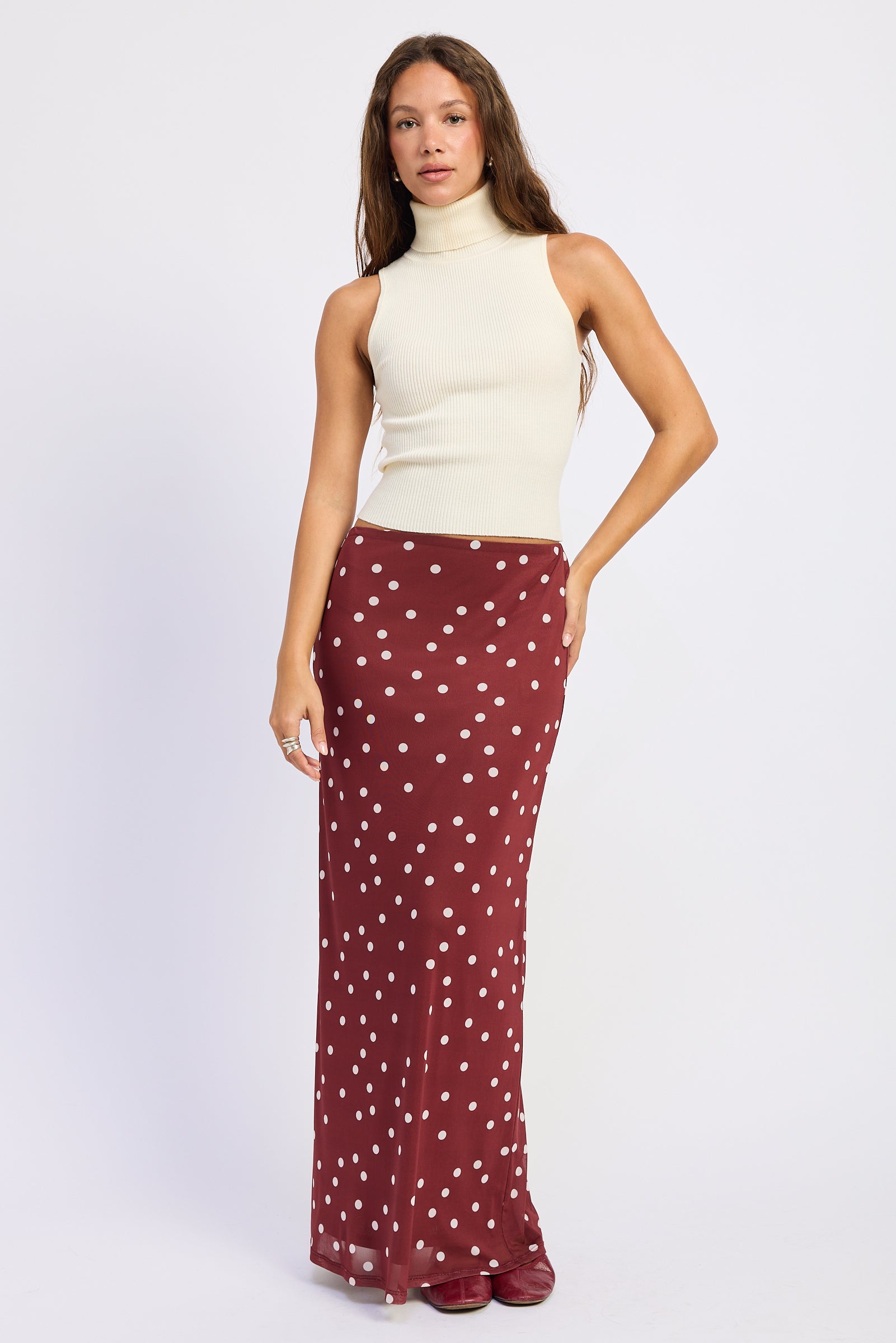 Maroon polka dot maxi skirt with cream dots and slim flared silhouette
