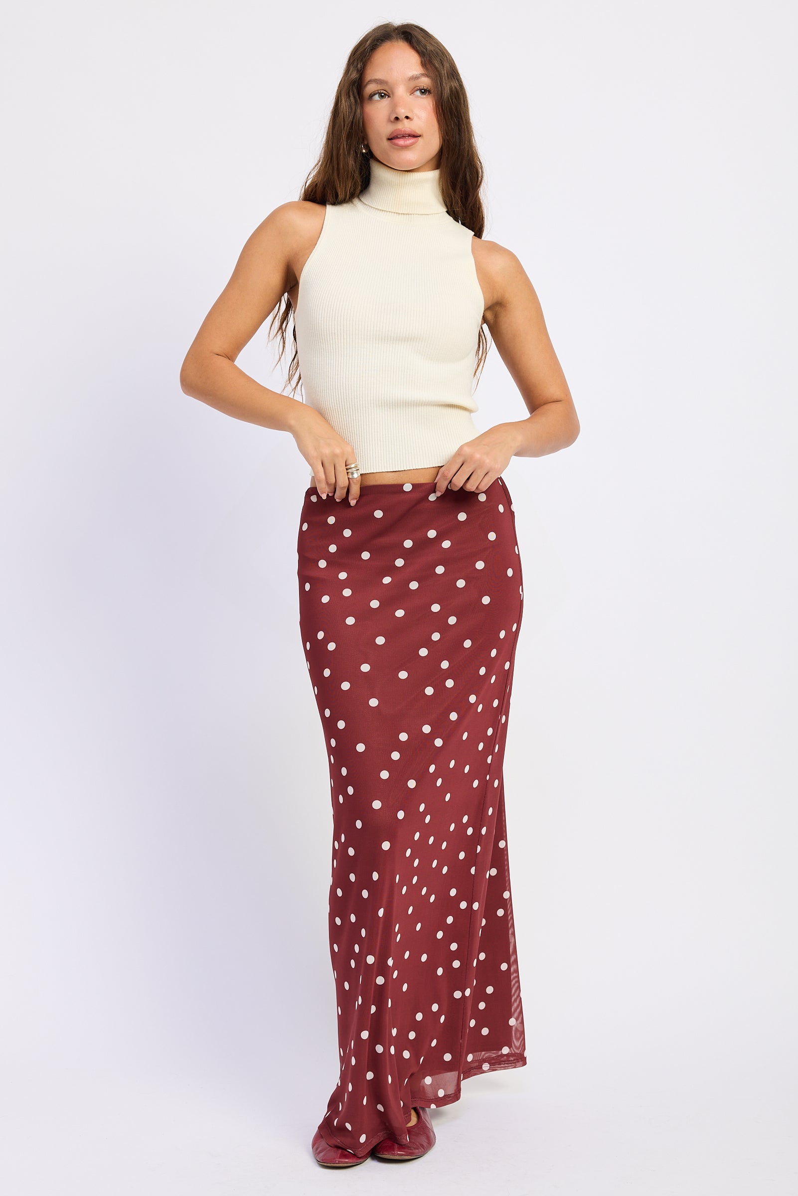 Maroon polka dot maxi skirt with cream dots and slim flared silhouette
