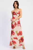 Full length front view of cream and red floral maxi dress styled with strappy sandals, AVAH