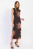 Side view of Ruched Midi Dress in chocolate brown with oversized flowers, sleeveless neckline and fitted silhouette.
