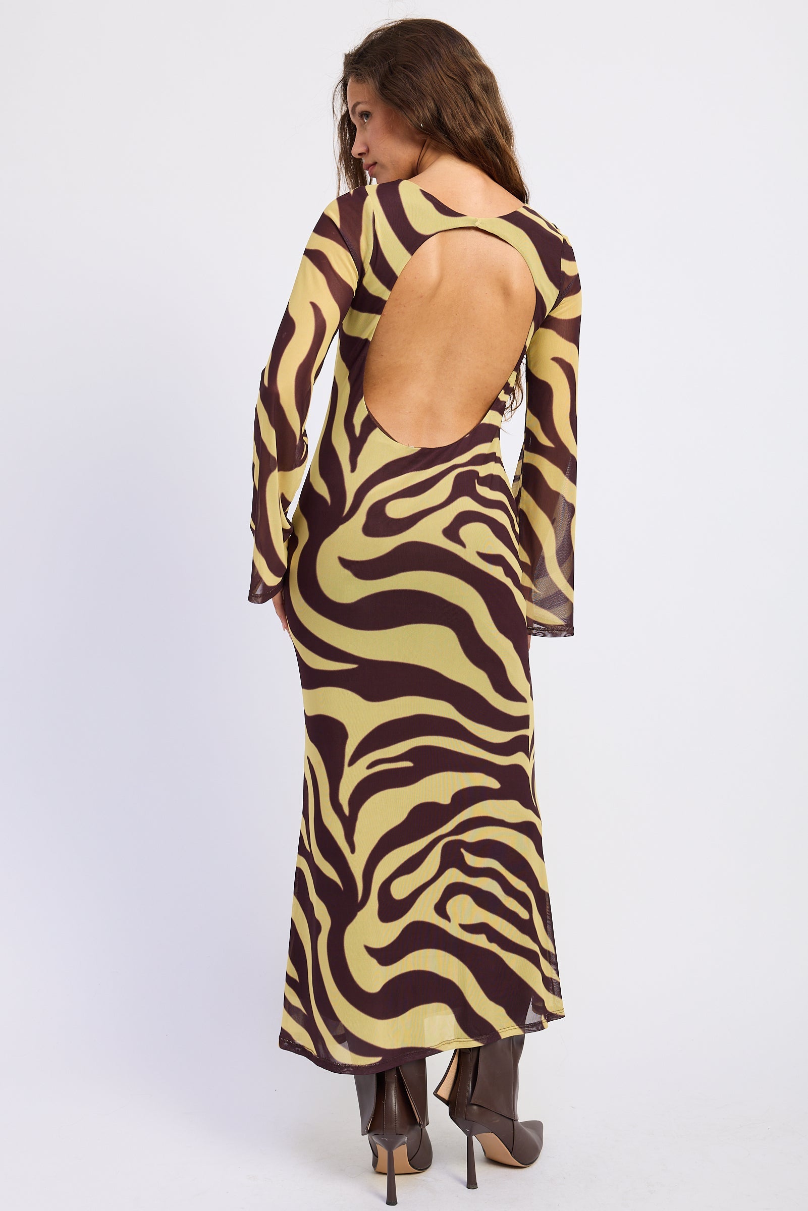 Back view of Sahara zebra print maxi dress showing large open back and chocolate brown zebra pattern.