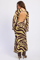 Back view of Sahara zebra print maxi dress showing large open back and chocolate brown zebra pattern.