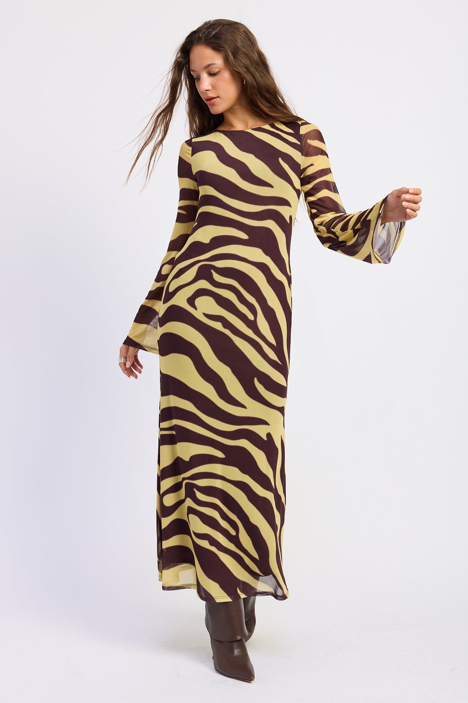 Sahara zebra open back maxi dress in brown and golden yellow with long bell sleeves, full front view.