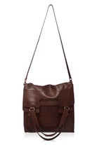 Brown leather handbag with a shoulder strap on a white background