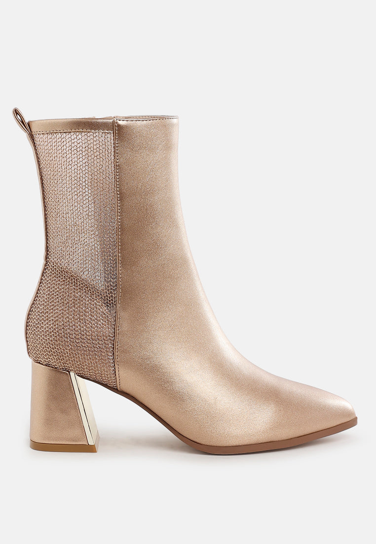 Gold ankle boot with mesh side on a white background