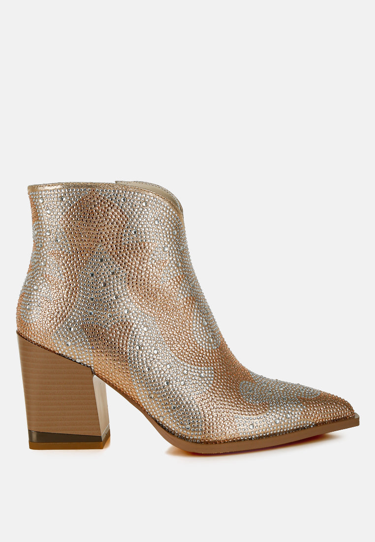 Metallic ankle boot with a block heel on a white background