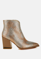 Metallic ankle boot with a block heel on a white background