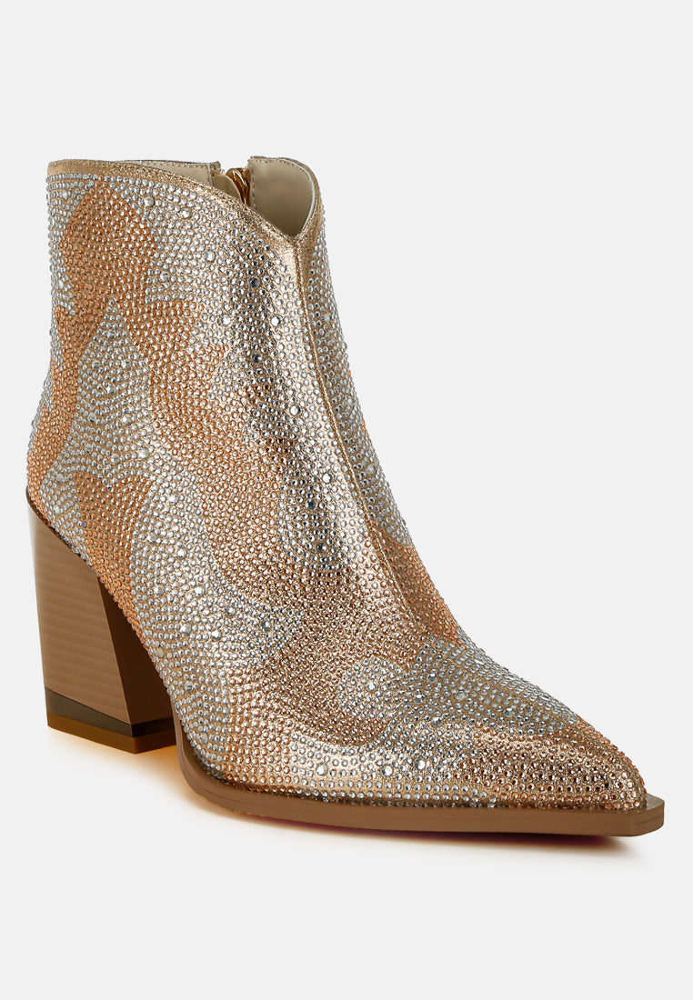 Silver studded ankle boot on a white background