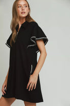 Side view of black flutter sleeve mini dress with contrast looped trim detail, AVAH
