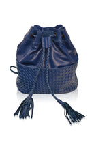 Blue leather woven backpack/handbag with braded drawstring opening with tassels and woven detail pocket on the front on white background, front view