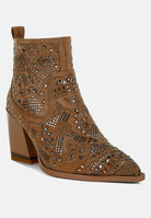 Brown suede ankle boot with laser-cut design on a white background