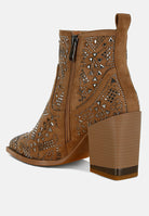 Brown ankle boot with laser-cut design and block heel on a white background