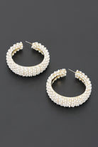 Front view of Pearl Reverie Statement Hoop Earrings featuring thick open hoops covered in clustered white pearls.