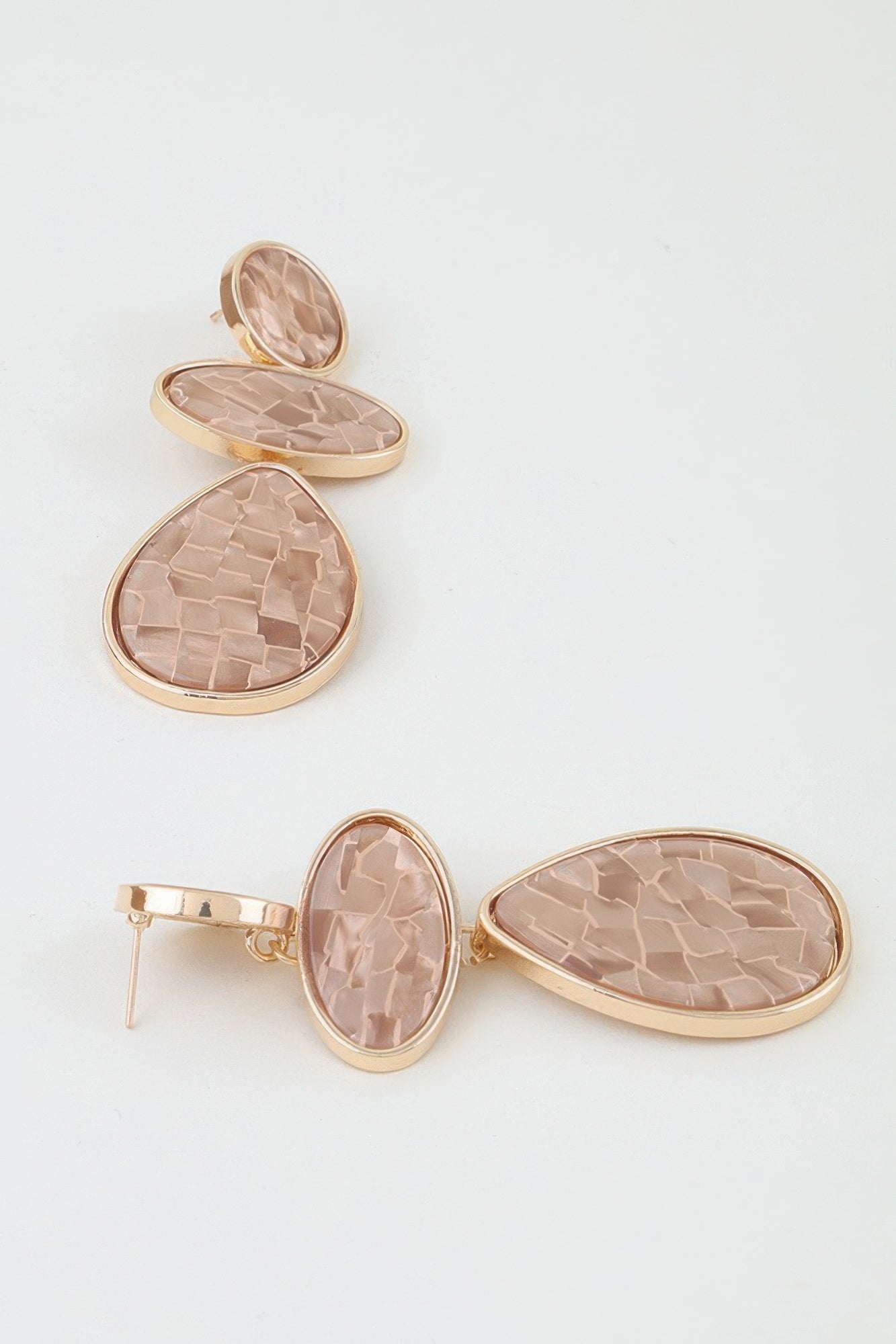 Rosewater Mosaic Drop Earrings with three cascading blush marbled stones in round, oval and teardrop shapes.

