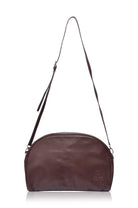 Brown leather shoulder bag on a white background
