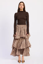 Sahara Spotted Ruffle Maxi Skirt in beige and brown animal print with oversized layered ruffles, front view.
