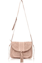 Beige woven handbag with a long adjustable strap on a white background