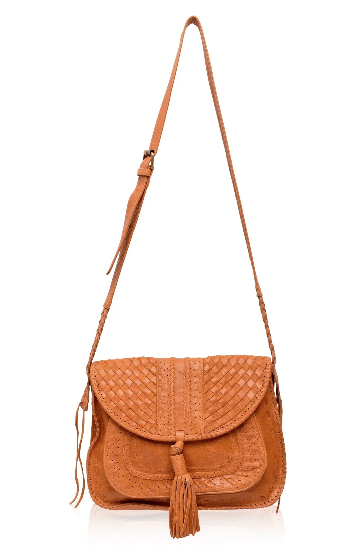 Tan woven leather crossbody bag with a tassel and a long adjustable strap on a white background