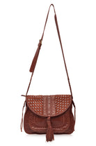 Brown worn leather woven handbag with a strap on a white background