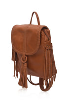 Brown leather backpack with fringe details on a white background