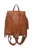 Tan leather backpack with fringe details on a white background