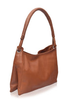 Brown leather handbag on a white background