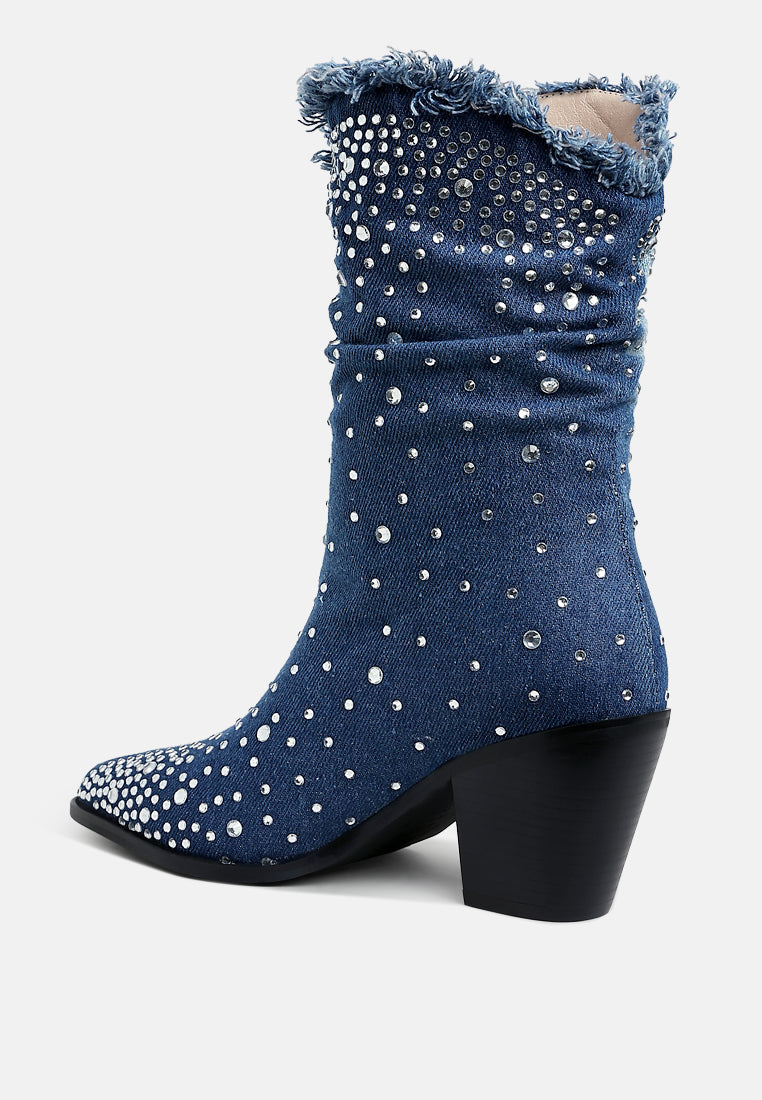 Blue denim boot with rhinestone embellishments on a white background back view