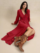 Scarlett Grace Button Front Maxi Dress in deep scarlet red — model sitting on ground posing