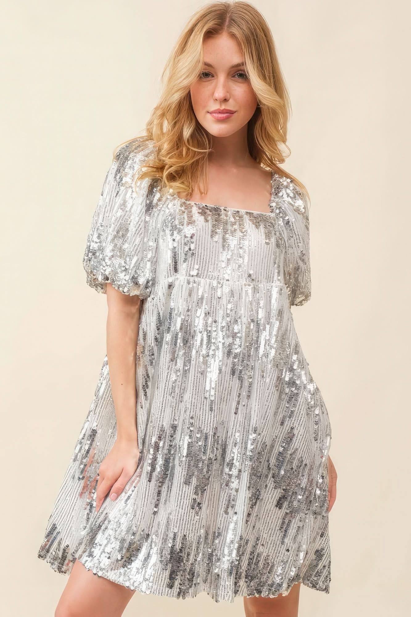 Model wearing a silver sequin mini dress with square neckline and puff sleeves, front view-AVAH
