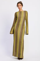 Solstice Stripe Long Sleeve Maxi Dress featuring earthy multicolor vertical stripes, boat neckline, bell sleeves, and full length silhouette.