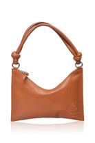 Tan leather handbag with a visible brand logo on a white background