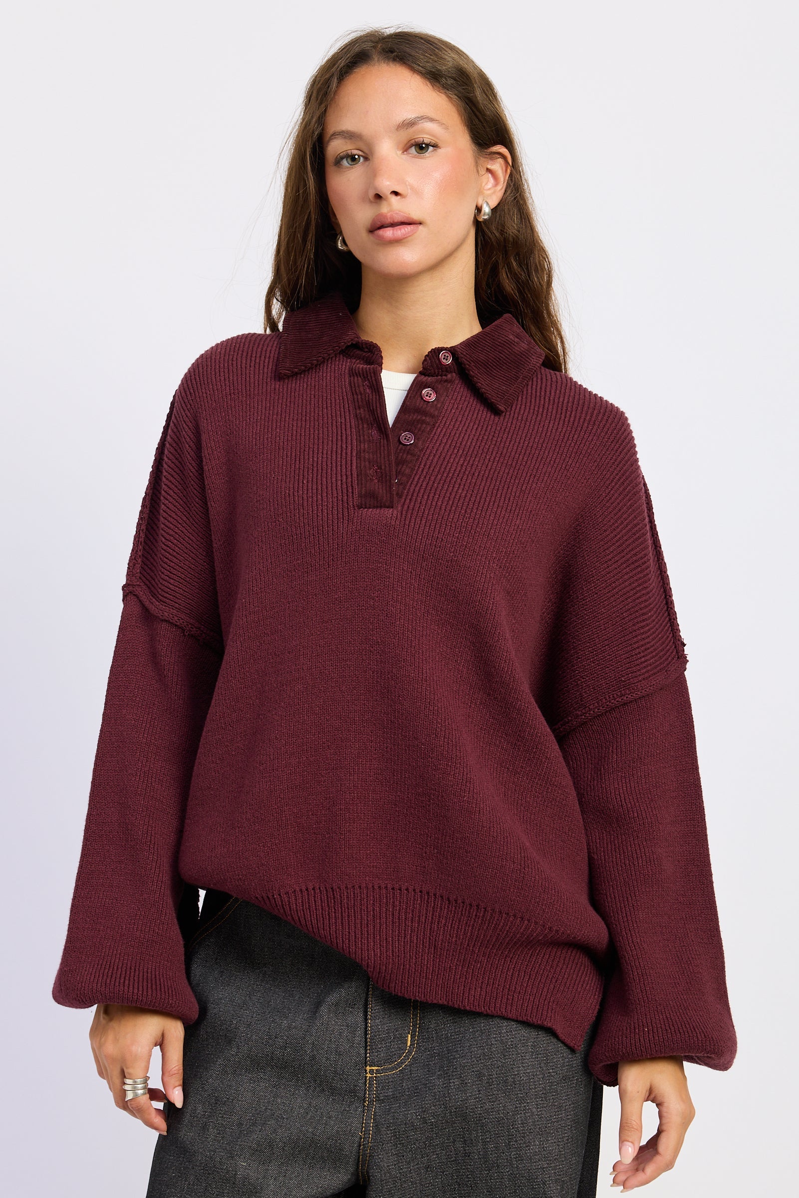 The Weekend Club Collared Knit Sweater in burgundy with ribbed polo collar, button neckline and relaxed oversized fit, front view.