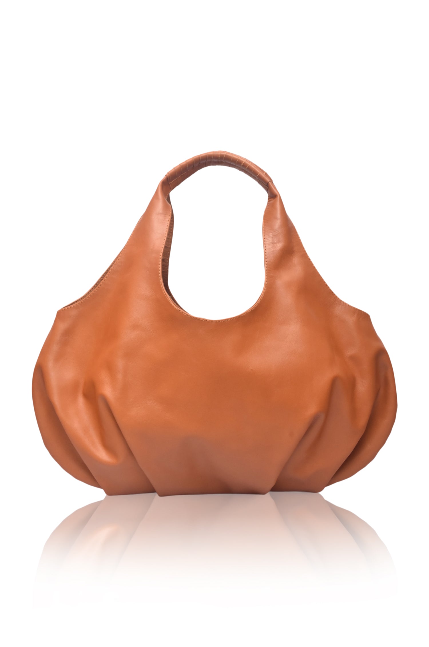 Large tan leather handbag on a white background, front view