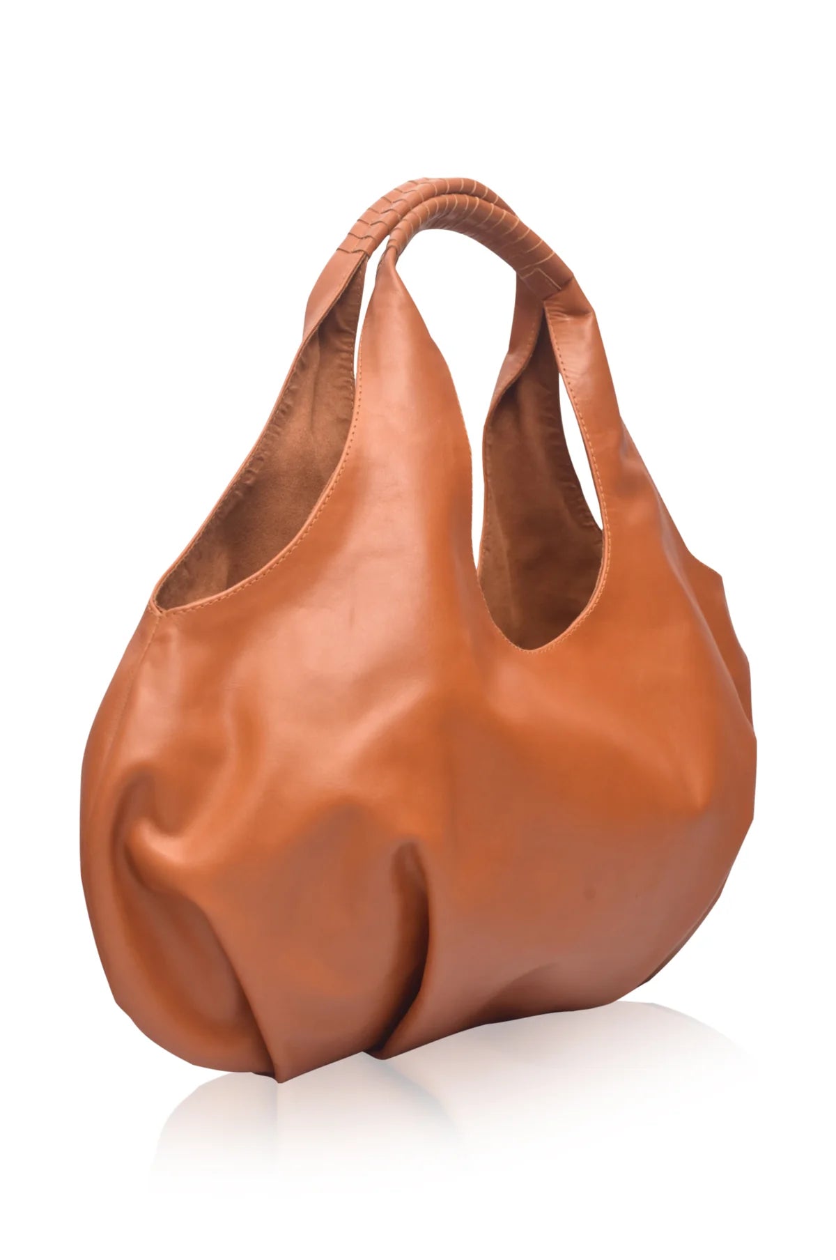 Tan leather handbag on a white background, 3/4 view