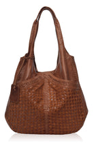 Brown woven handbag on a white background