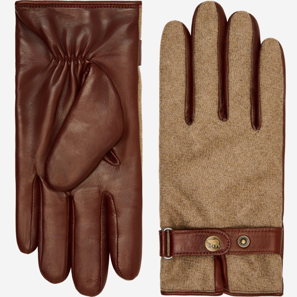 Pair of brown leather and beige fabric gloves with a strap on a white background