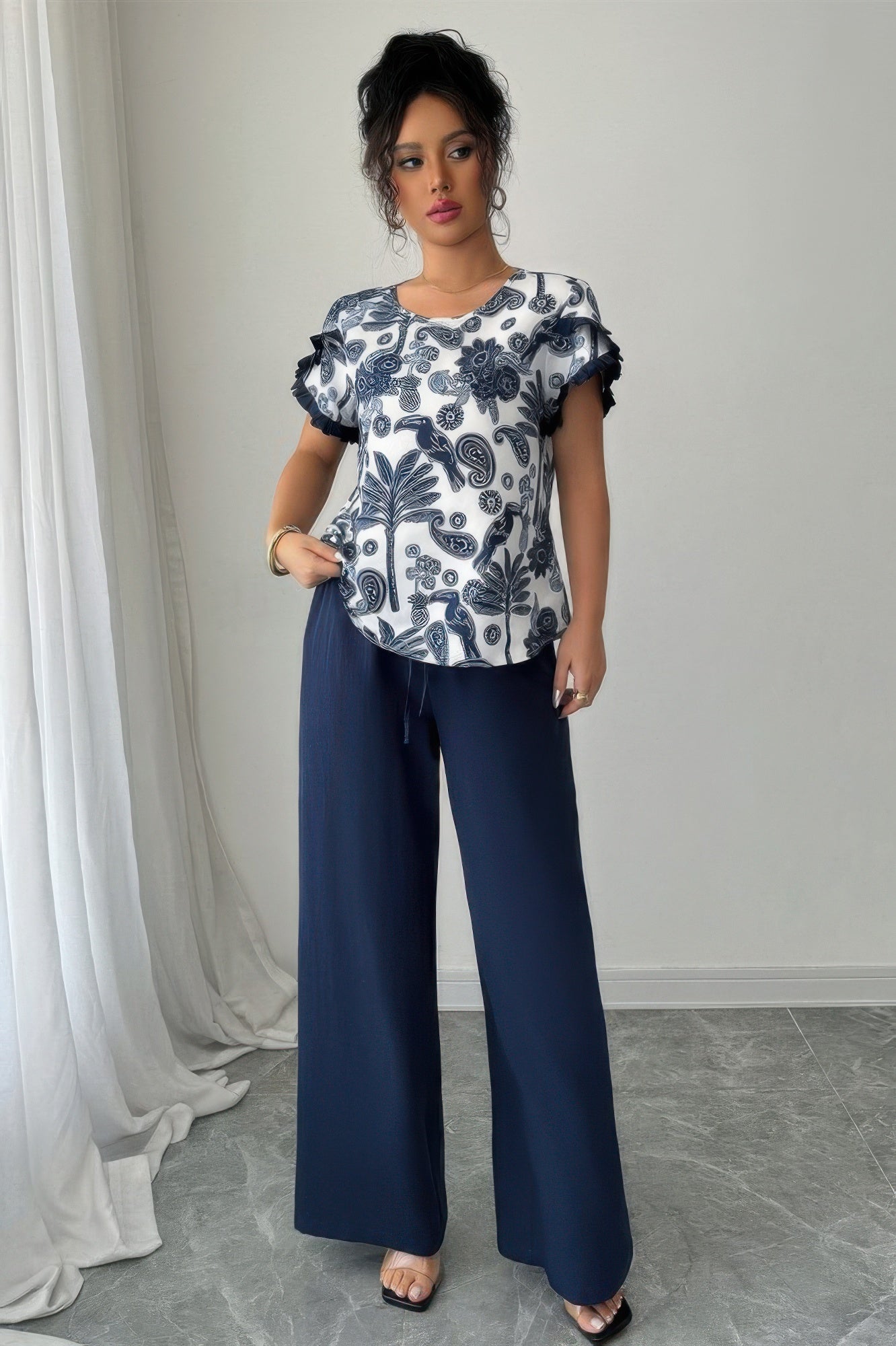 Midnight Botanical Pant Set with botanical print flutter sleeve top and navy wide leg pants