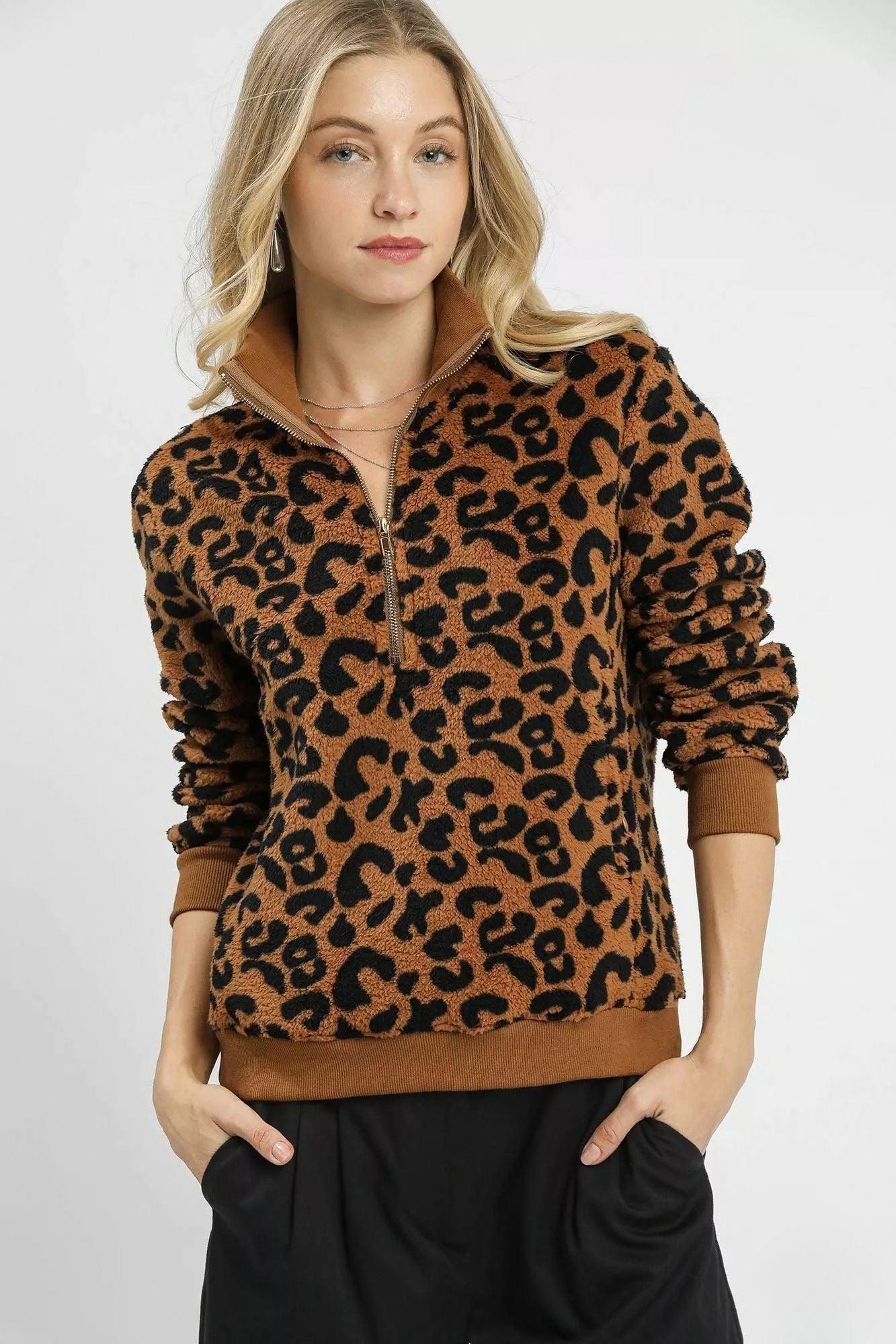 Wildwood Leopard Sherpa Quarter Zip Pullover in camel and black with high collar and ribbed trim, front view.