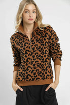 Wildwood Leopard Sherpa Quarter Zip Pullover in camel and black with high collar and ribbed trim, front view.