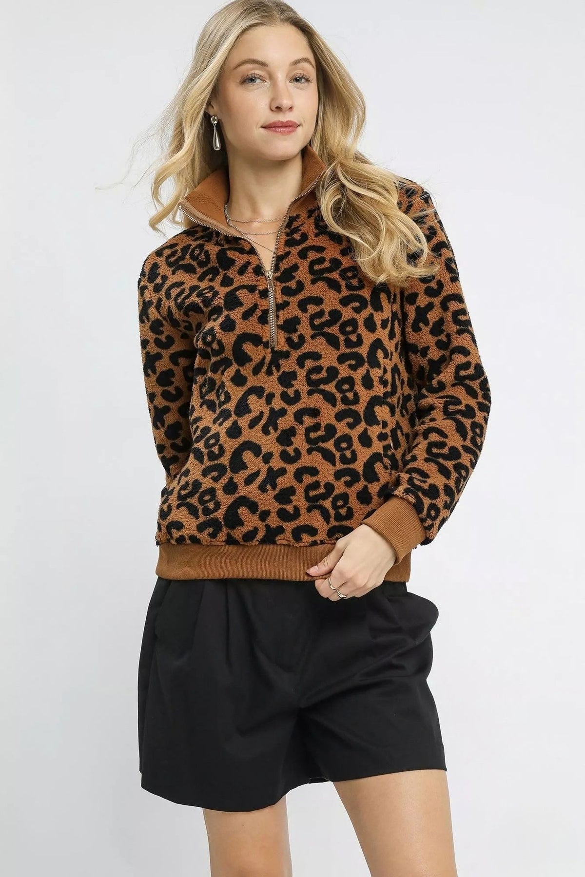 Wildwood Leopard Sherpa Quarter Zip Pullover in camel and black with high collar and ribbed trim, front view.