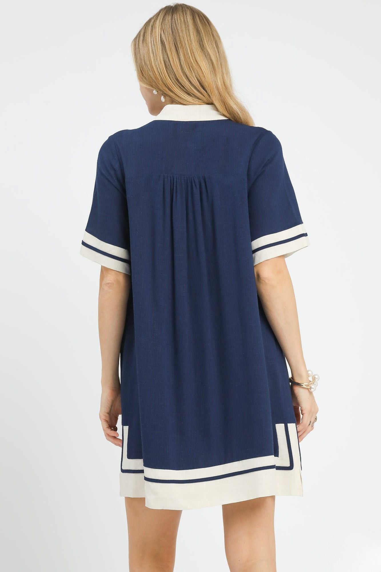 Back view of Yacht Club Linen Mini Dress showing contrast striped hem border and shift silhouette, AVAH
